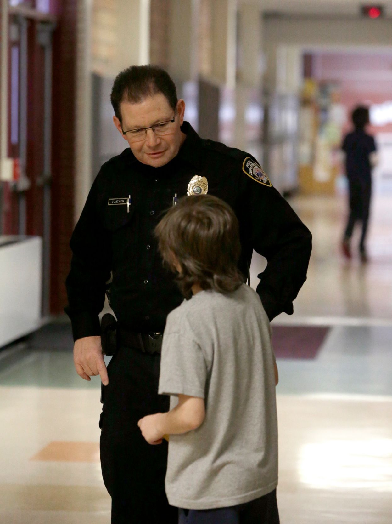George Zorzakis talks with a student